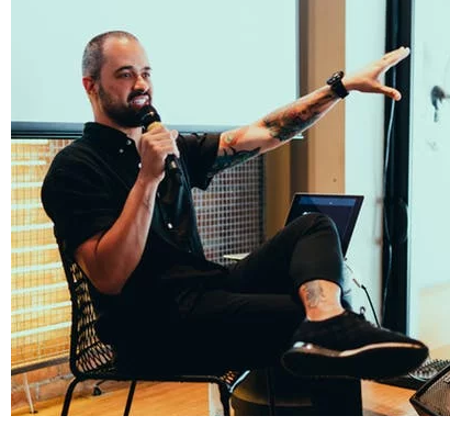 Speaker presenting at a conference.